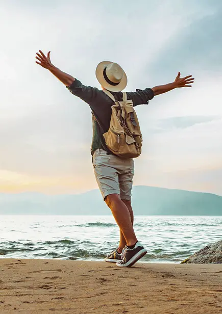 Heal from Addiction at Our Methadone Clinic - ASAP Mental Health Clinic Man on Beach With Hands Up